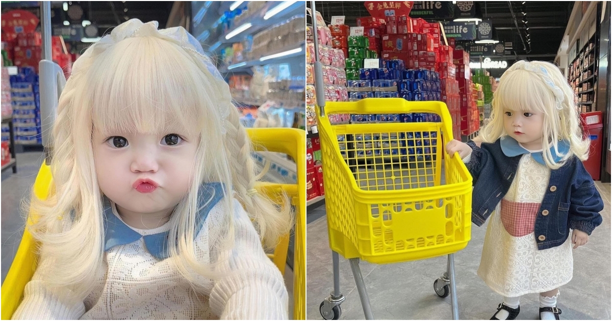 “The baby with beautiful platinum hair is breathtakingly attractive, attracting shoppers at the mall”